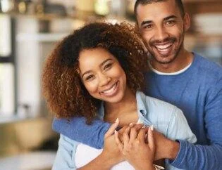 A beautiful couple are happy with cleaning services nearby where a man with blue t short and girl in light blue jeans short and curly hairs are smiling