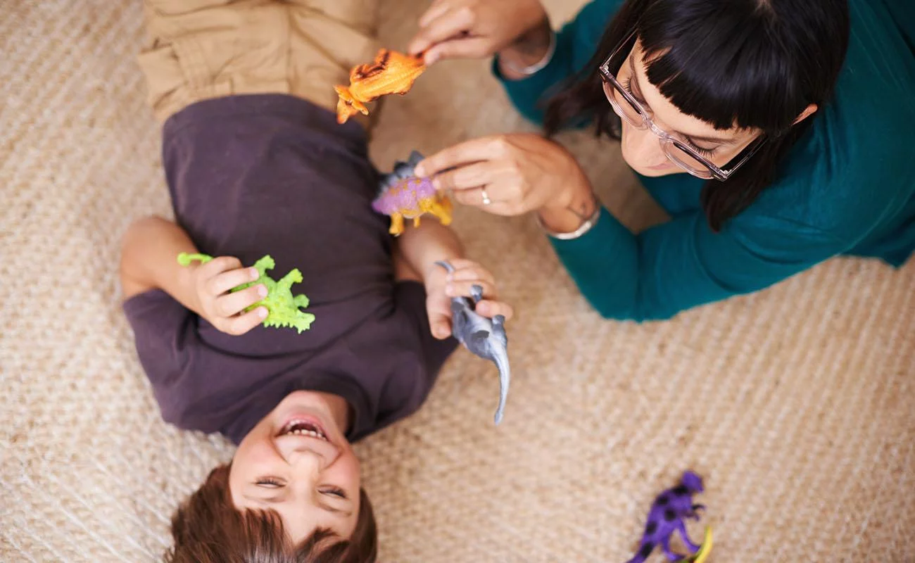 Happy child and mother playing after a house cleaning session by OnCleaning